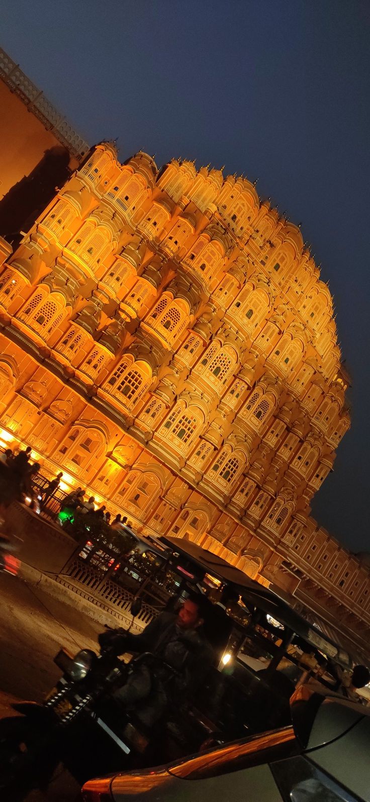 an ornate building lit up at night time