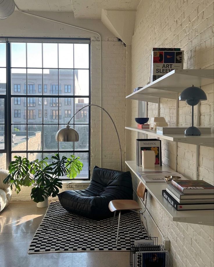 a living room filled with furniture and a large window