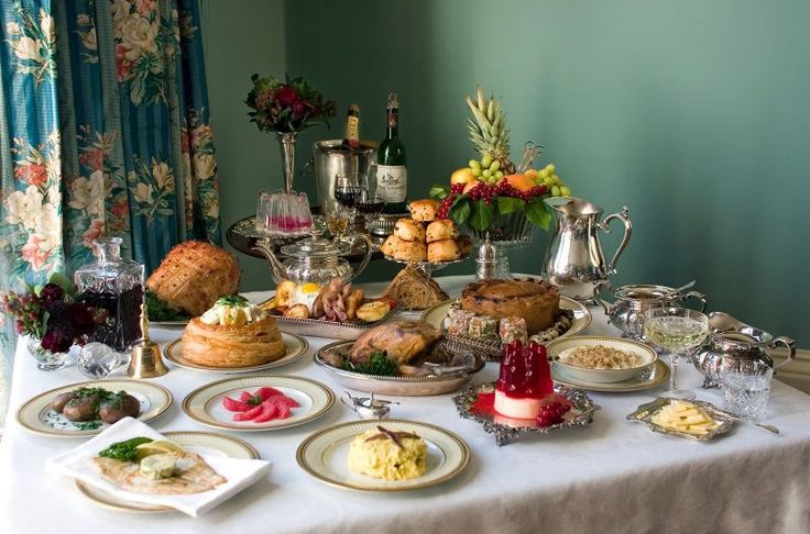 a table topped with lots of different types of food and drinks on top of it