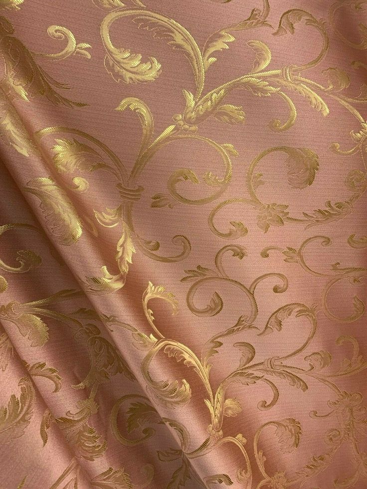 a pink and gold wallpaper with an intricate design on it's side,