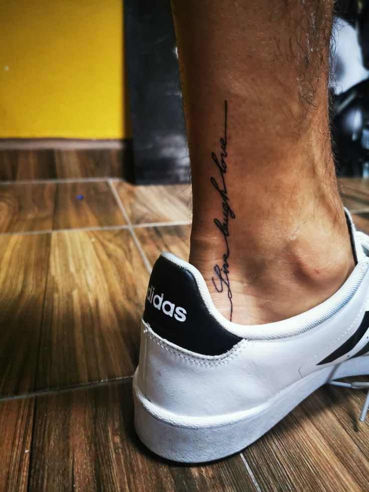 a person with a tattoo on their foot