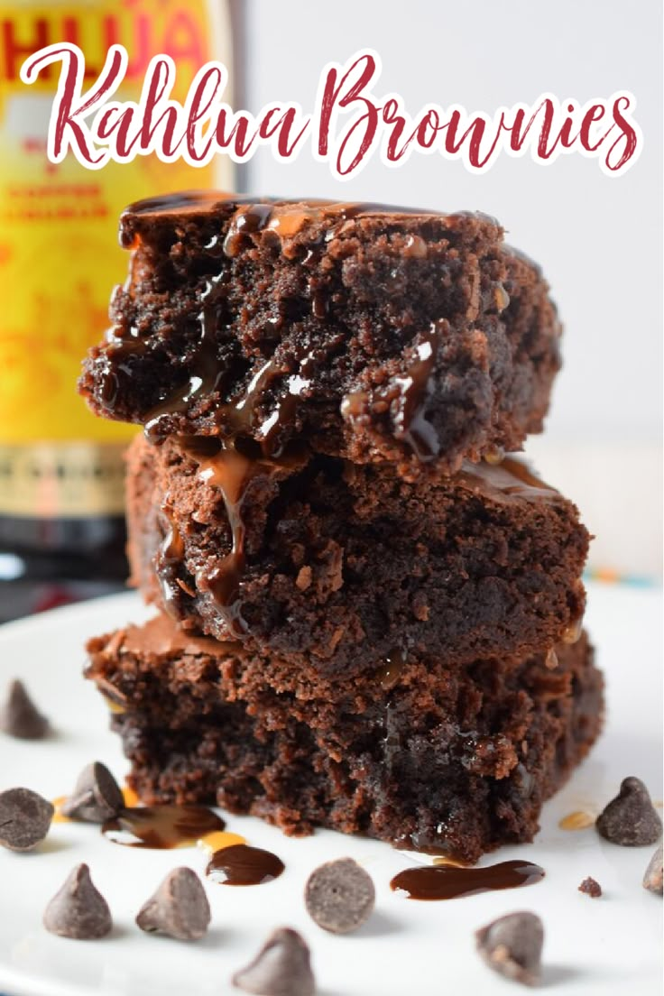 two chocolate brownies stacked on top of each other with the words kahlua brownies above them