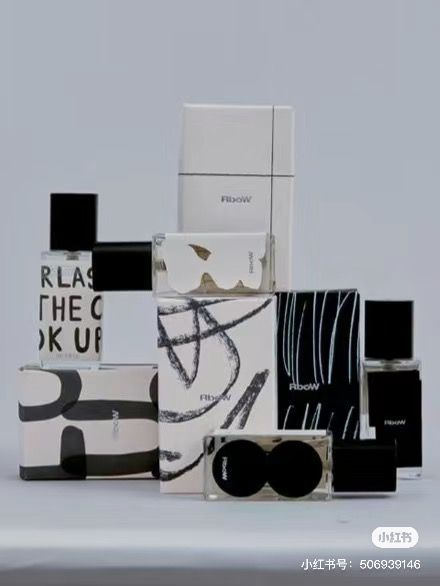 several boxes and sunglasses are stacked on top of each other in front of a gray background