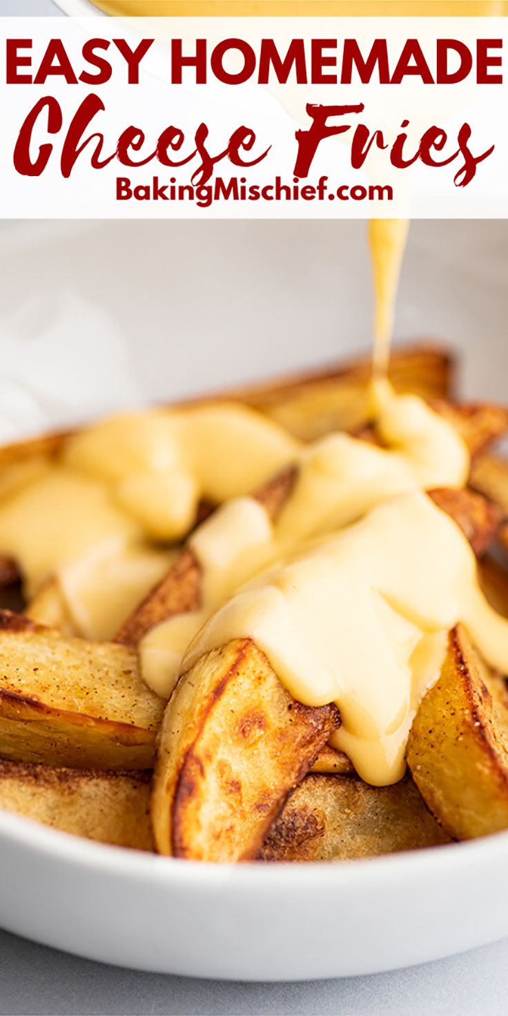 homemade cheese fries in a white bowl with sauce being drizzled over them