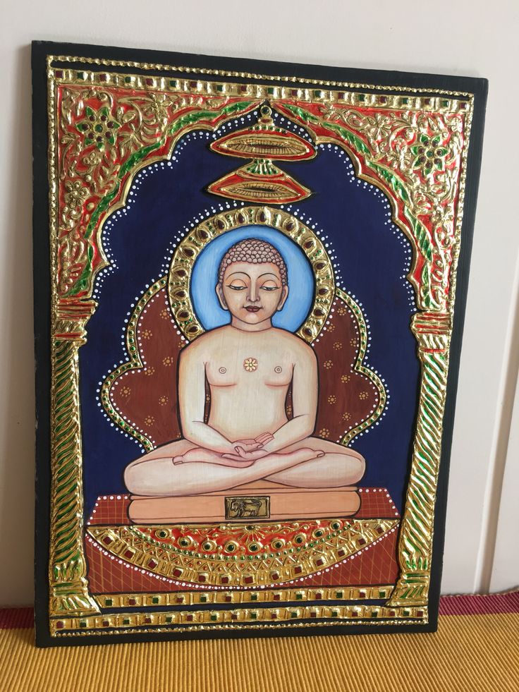 a painting of a buddha sitting on top of a wooden table next to a wall