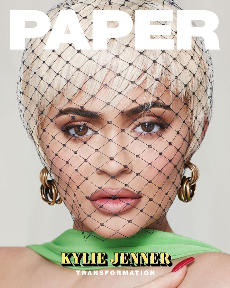 a magazine cover with a woman wearing a veil over her head and the words paper on it