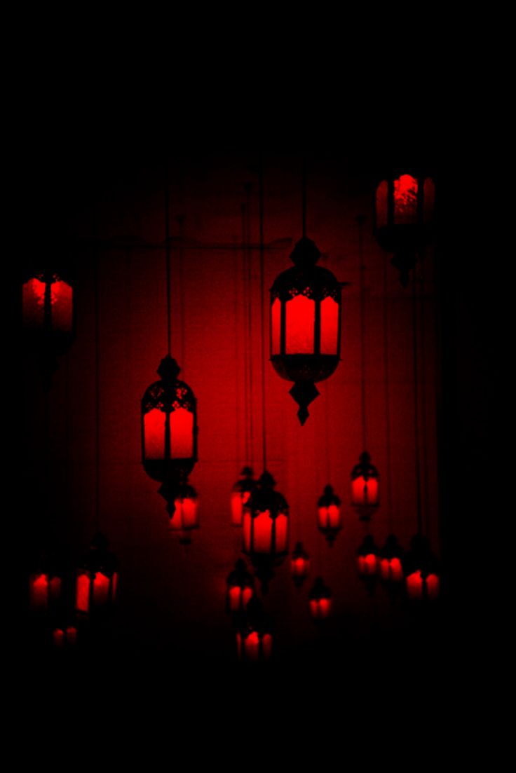 red lanterns are hanging in the dark