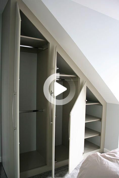 an attic bedroom with two closets in it