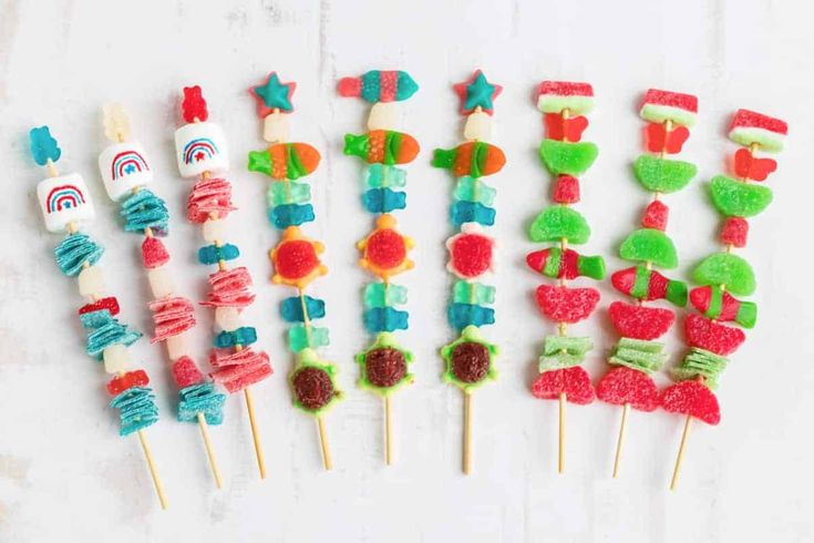 colorful candy lollipops are arranged on toothpicks