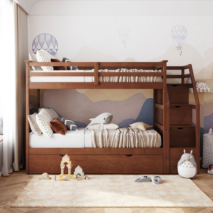 there is a bunk bed with two drawers underneath it and toys on the floor below