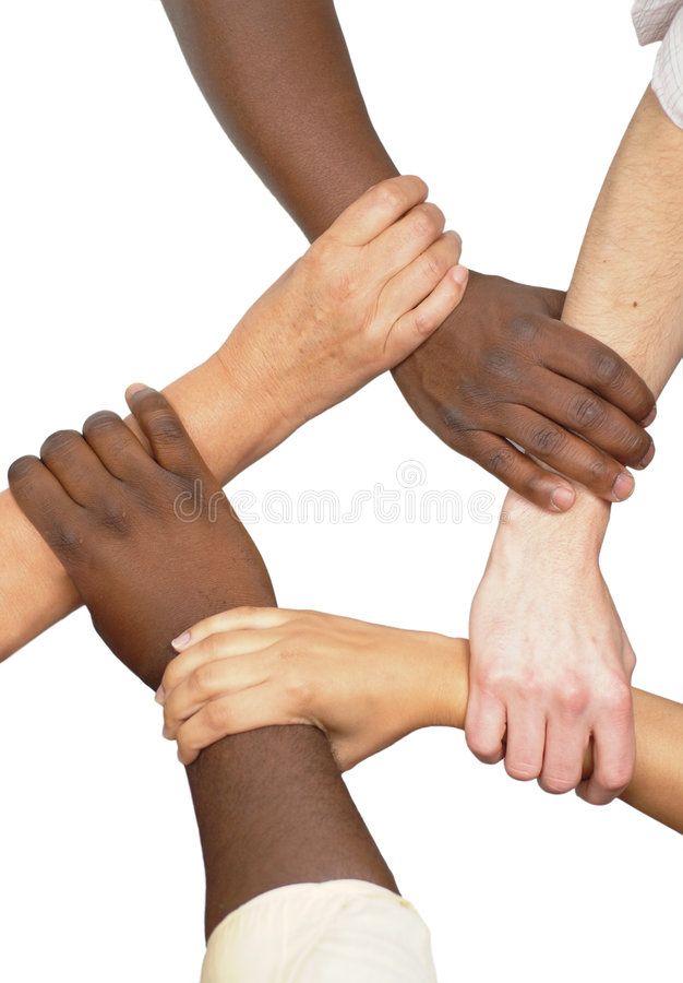 several people's hands stacked together on top of each other in the middle of a circle