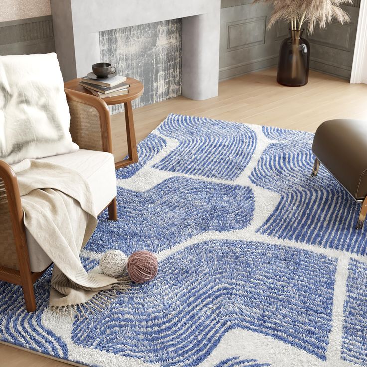 a living room with a blue rug and chair