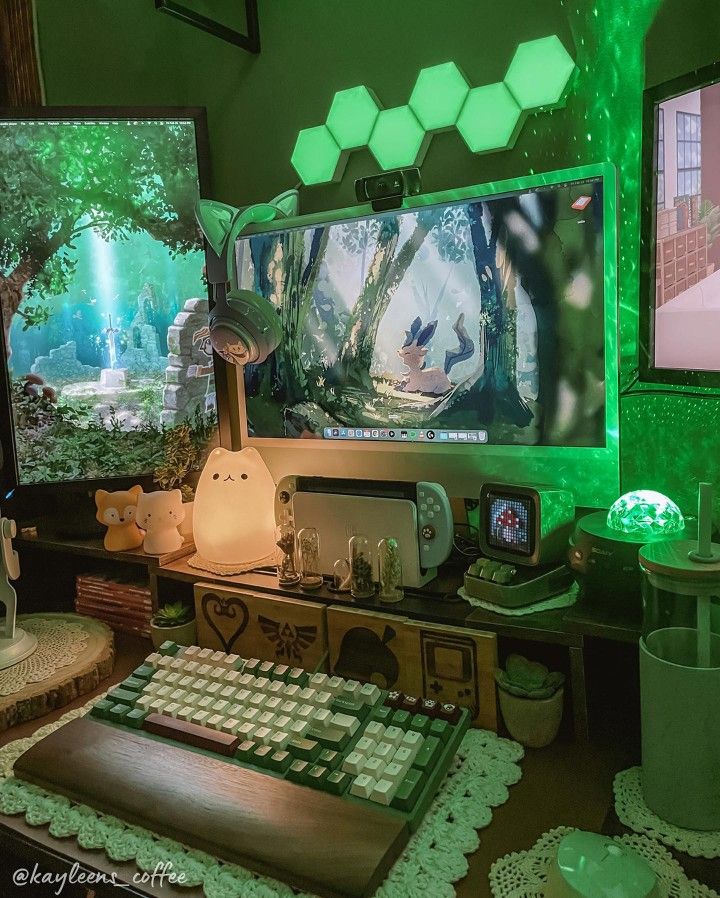 a computer desk with two monitors and a keyboard on it, in front of green lights