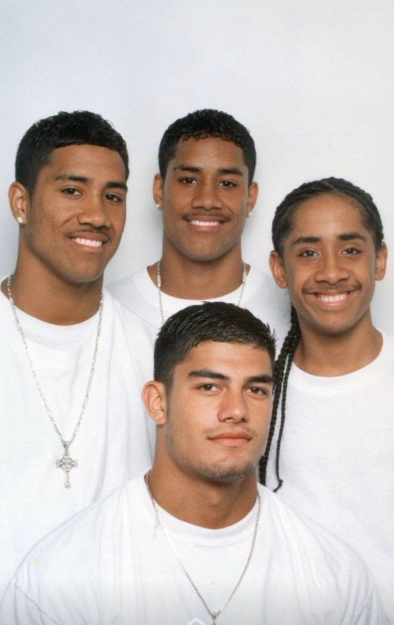 four young men are posing for a photo in their white t - shirts and braids