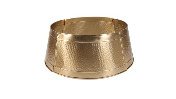 a gold metal bowl on a white background