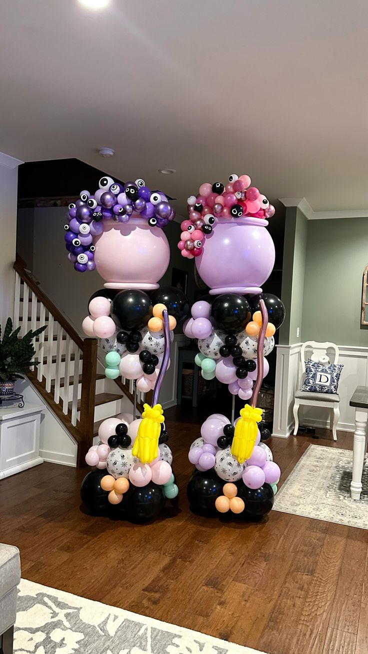 two balloon sculptures in the middle of a living room