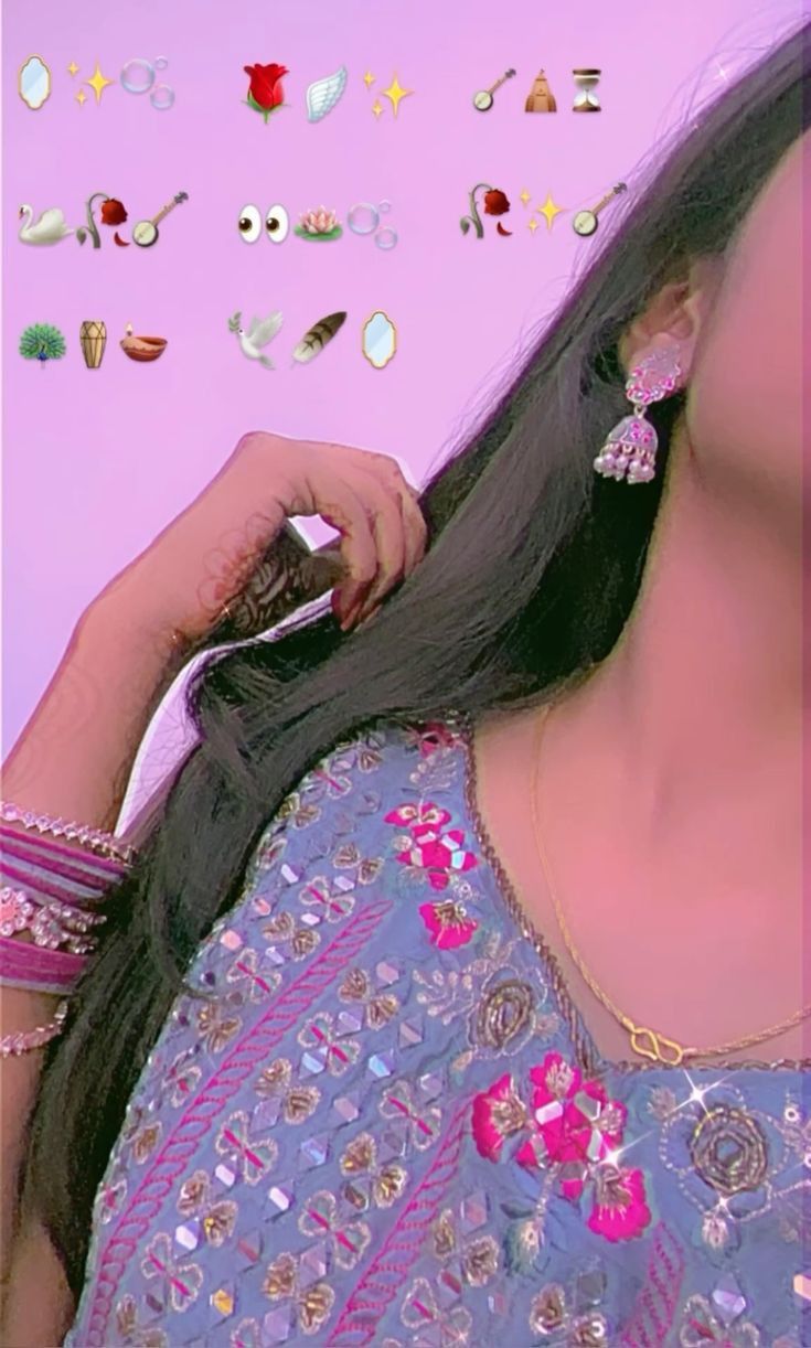 a woman with long black hair and earrings