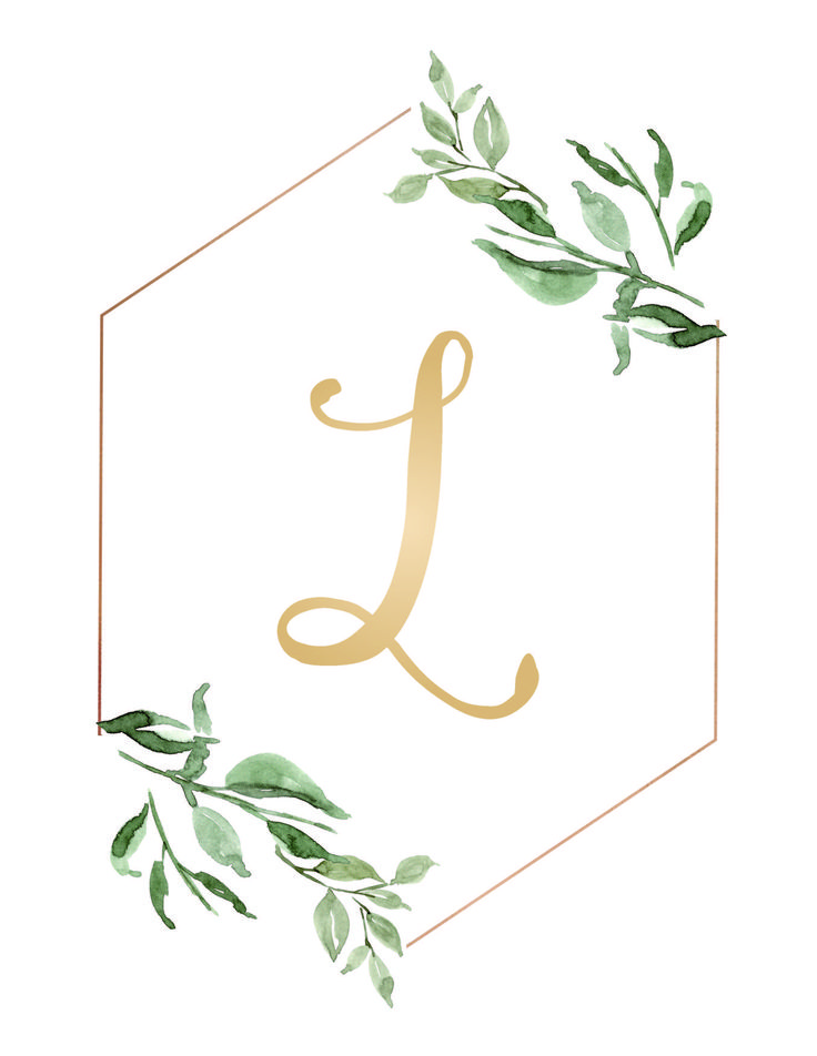 the letter l is surrounded by green leaves and gold foil on a white hexagonal background