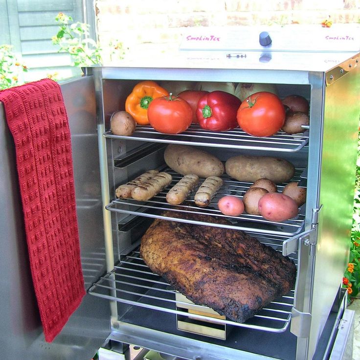 an oven with several different types of food in it