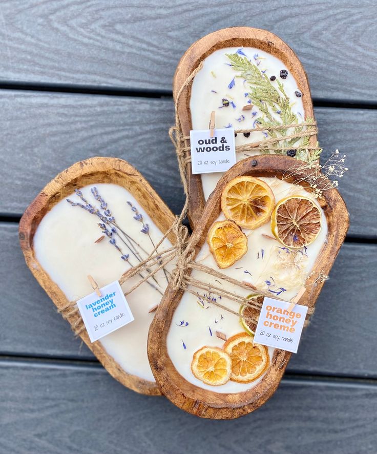 two slices of bread with dried oranges and lavender on them sitting on a table