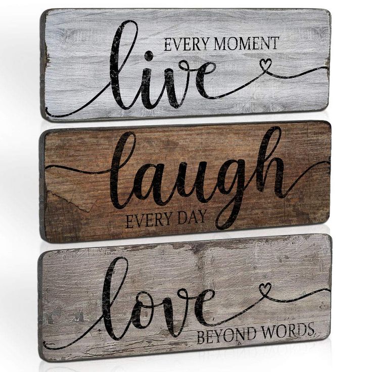 three wooden signs with the words live laugh love and beyond words in black on them