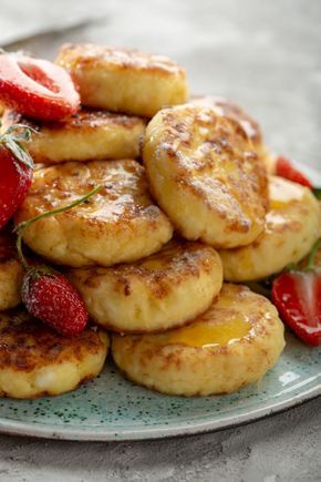 some pancakes and strawberries on a plate