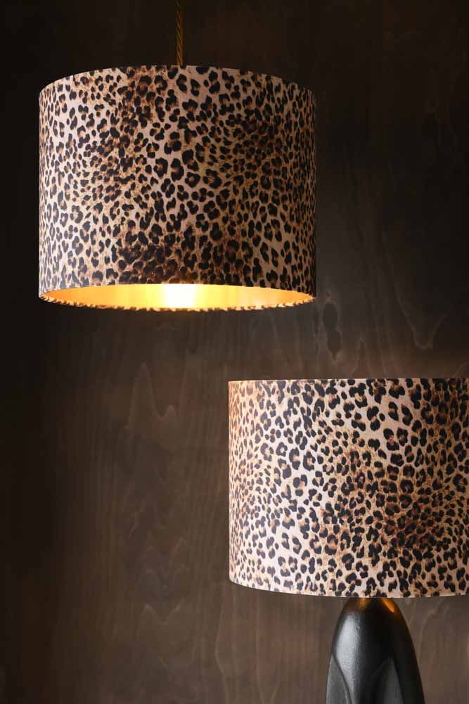 two leopard print lamps hanging from the ceiling