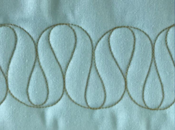 four circles are stitched together on the fabric