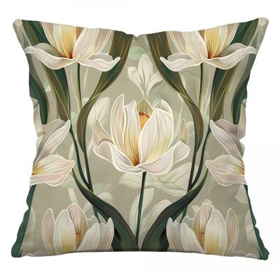 a decorative pillow with white flowers on the front and green leaves on the back,