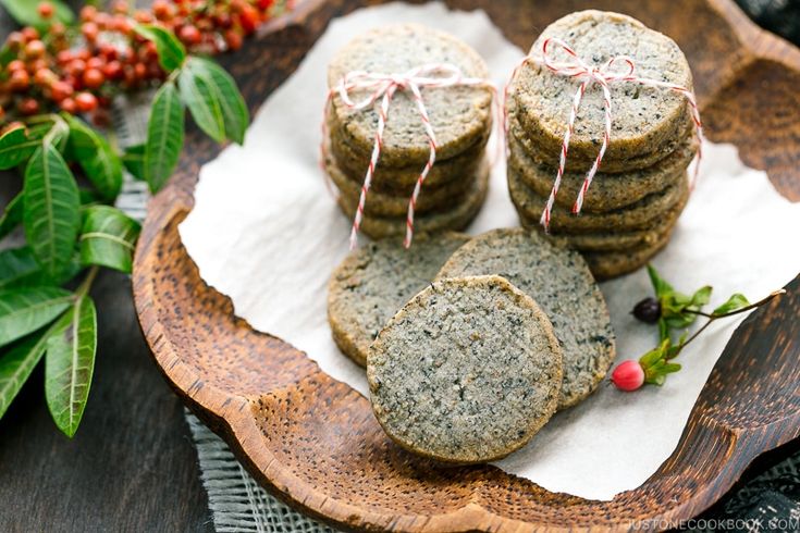 some cookies are sitting on a wooden plate