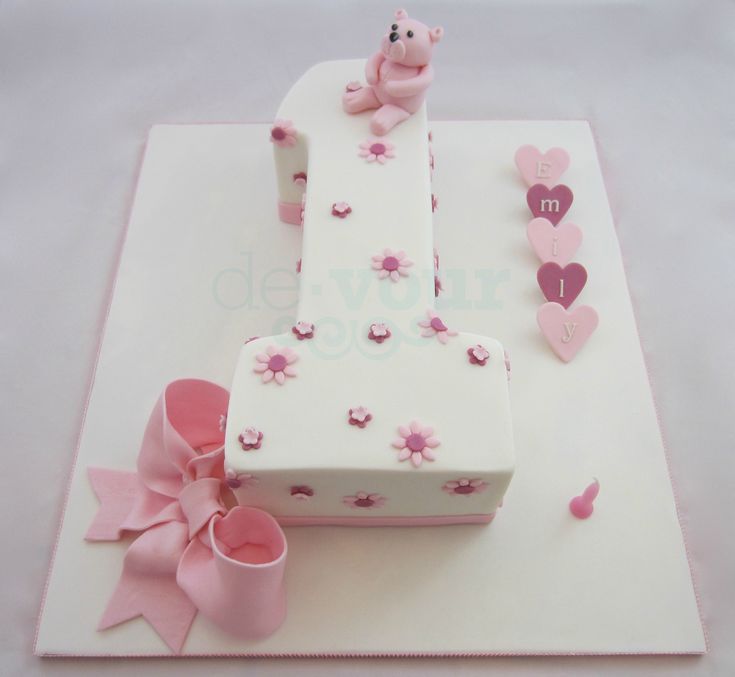 a birthday cake with pink decorations on it