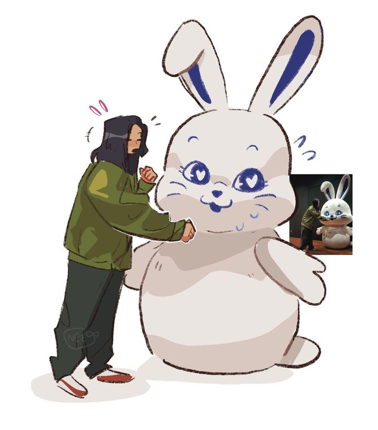 a man standing next to a giant bunny