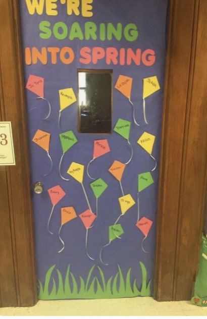 a door decorated with post it notes and the words we're soaring into spring