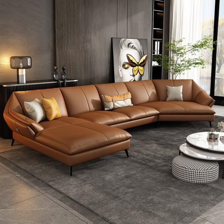 a living room filled with lots of brown furniture and decor on top of a gray rug