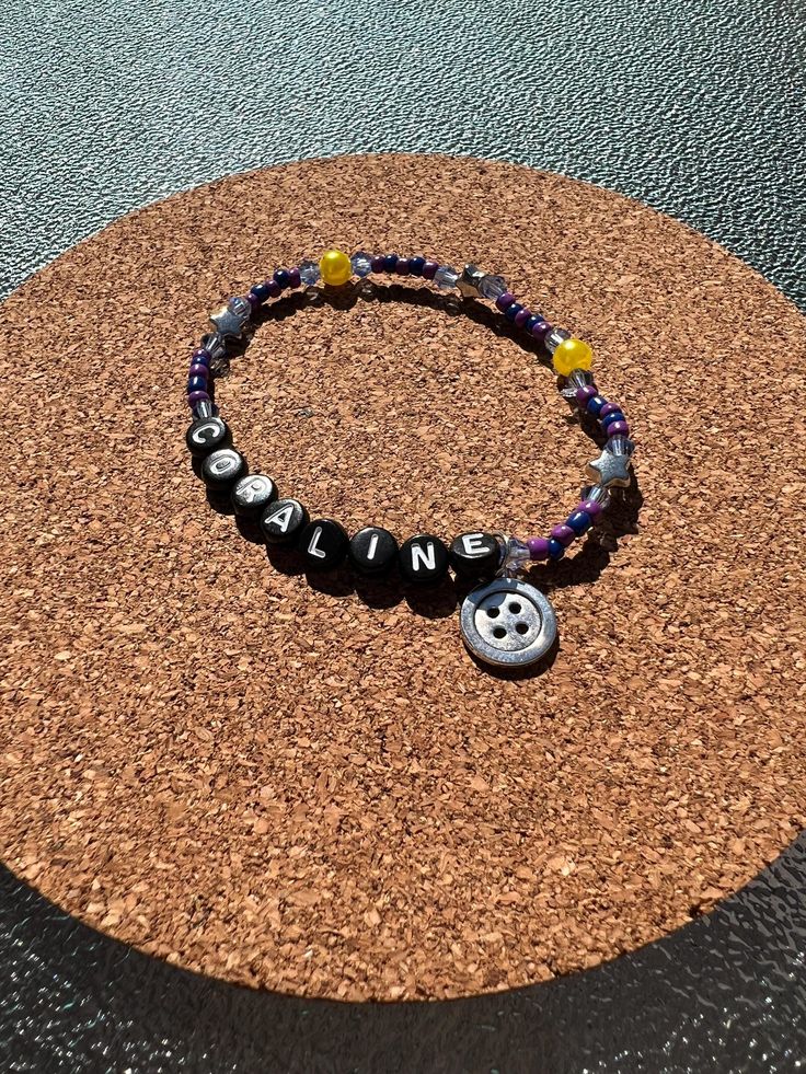 All bracelets are handmade by me using quality materials. Coraline Jewelry Diy, Coraline Clay Bead Bracelet, How To Make Coraline Necklace, Coraline Beaded Bracelet, Coraline Clay, Coraline Bracelet, Coraline Charm Bracelet, Halloween Bracelet, Clay Bracelet