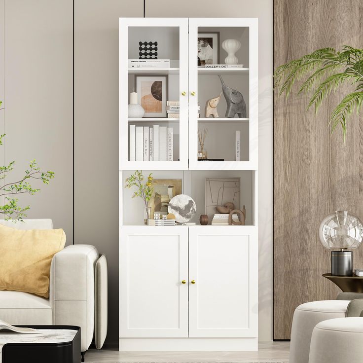 a living room with a white bookcase next to a couch and table in front of it