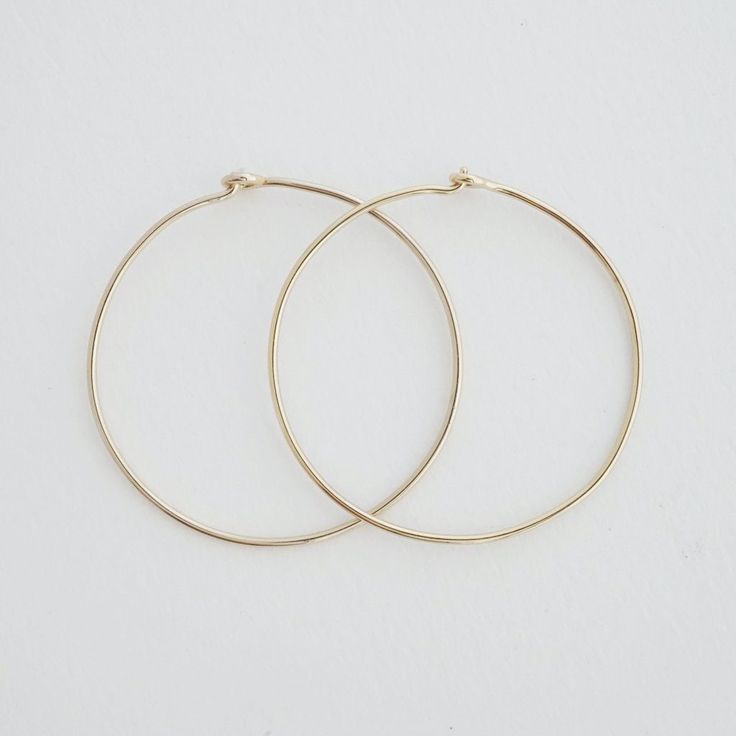 Our large, skinny hoops are an essential addition to your earring collection! They are beautiful alone or pair them with our ear cuffs. These measure 1.25" tall. Made from high quality materials for longevity. Our earrings are plated with 18k gold and finished with a protective coating. Love, love, love these hoops! Hoops Silver, Earring Collection, Hoop Earring Sets, Between Us, Rainbow Crystal, Delicate Jewelry, Star Studs, Accessories Jewelry Earrings, Earrings Collection