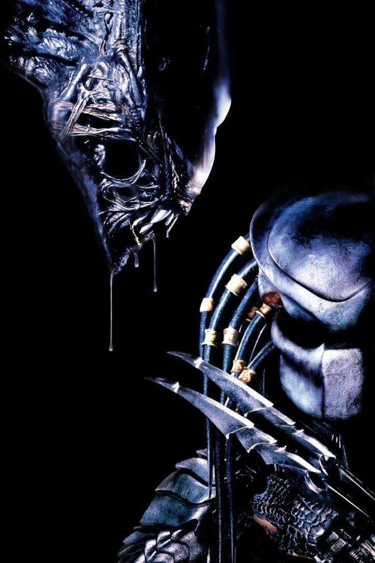 an alien man and woman face to face with each other in front of a black background