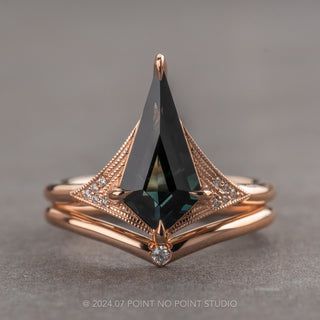 a rose gold ring with a black diamond