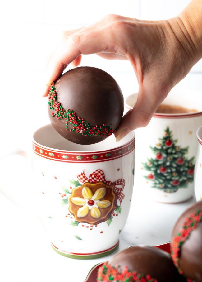 How to Make Hot Chocolate Bombs - Hot cocoa balls are delightful customizable gifts that are easy to make at home! This recipe includes mini marshmallows and colorful sprinkles for extra festive - and tasty! - holiday treats. Plus, we add a pinch of cinnamon and salt to each bomb for special kick of winter flavor. | A Spicy Perspective Christmas Chocolate Balls, Burrrrr Basket, Hot Cocoa Balls, Hot Chocolate Balls, Cocoa Balls, Chocolate Balls Recipe, Chocolate Line, Chocolate Ball, Hot Cocoa Bomb