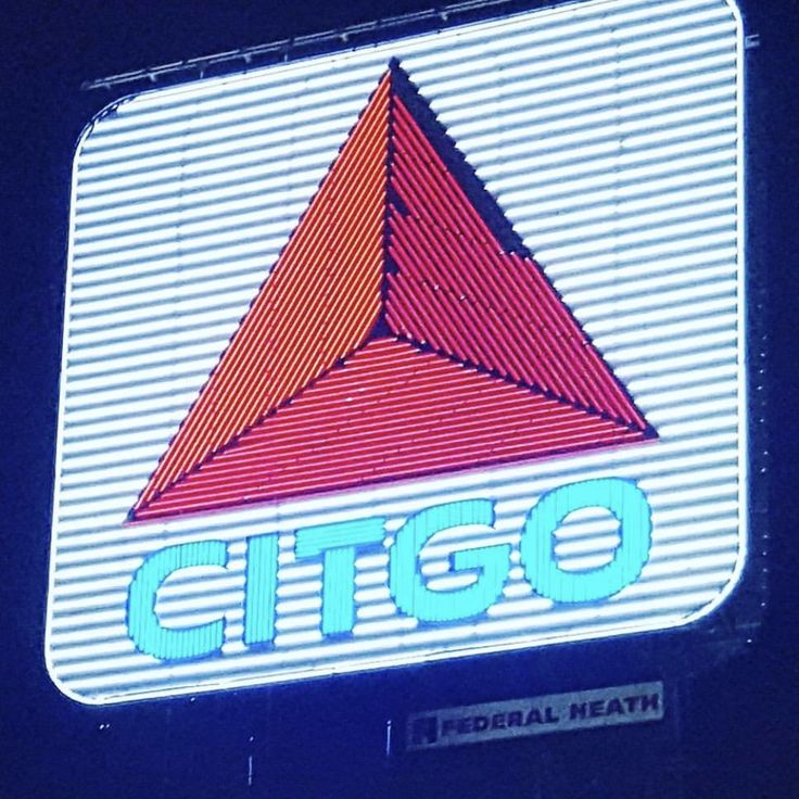 the citco sign is lit up in blue and red colors with an orange triangle