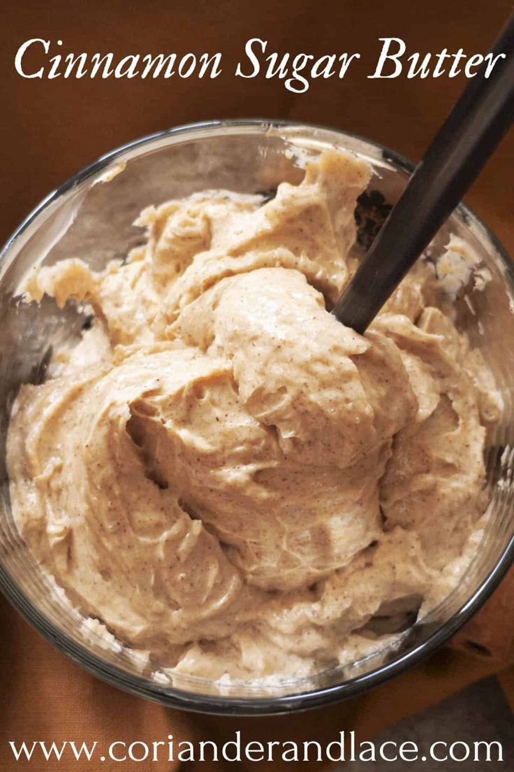 cinnamon sugar butter in a glass bowl with a black spoon on the side and text overlay that reads cinnamon sugar butter