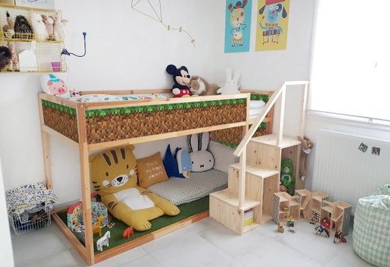 a child's bedroom with a bunk bed and stuffed animals on the bottom shelf