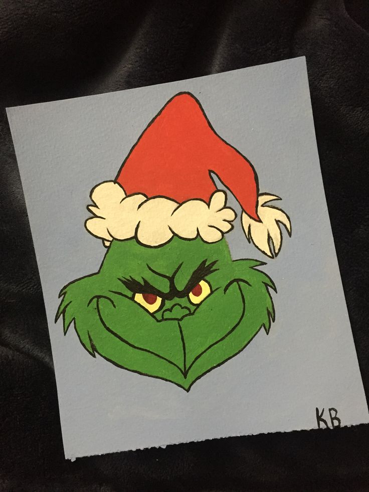 an image of the grin face on a piece of paper with santa's hat