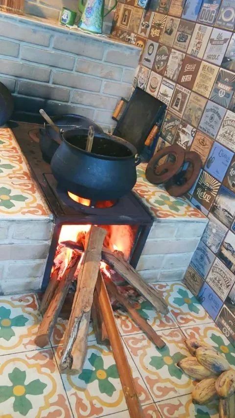 an old fashioned stove with pots and pans on it