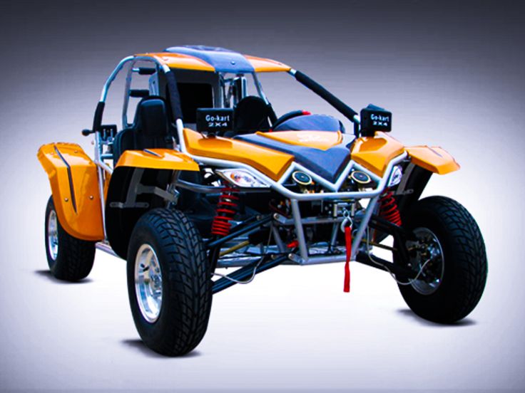 an orange and black four wheeled vehicle on a white background