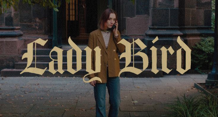 a man talking on a cell phone while standing in front of a building with the word lady bird