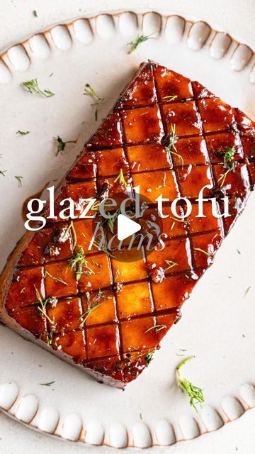 a piece of food that is sitting on a plate with the words glazed tohi