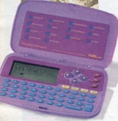 a purple and blue calculator sitting on top of a white table next to a stuffed animal