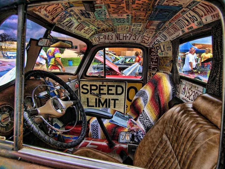 the interior of an old car is covered in graffiti